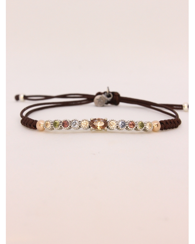 Pulsera de plata con cuarzo fumé central talla cabujón y espinelas de colores.
Ajustable a todas las medidas mediante cierre en
