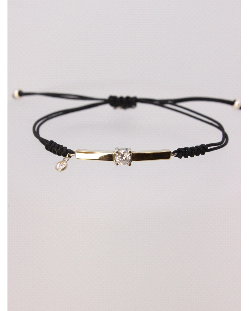 Pulsera de plata de ley con oro y espinela blanca central.
Ajustable a todas las medidas mediante cierre en forma de nudo corre