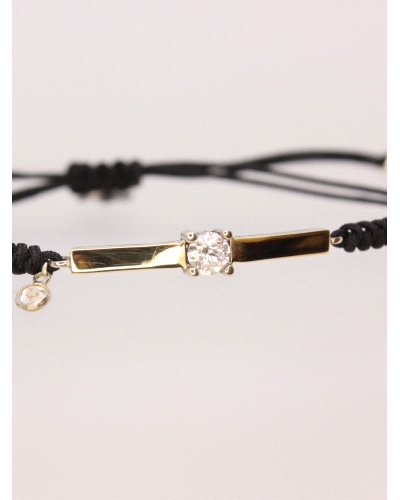 Pulsera de plata de ley con oro y espinela blanca central.
Ajustable a todas las medidas mediante cierre en forma de nudo corre