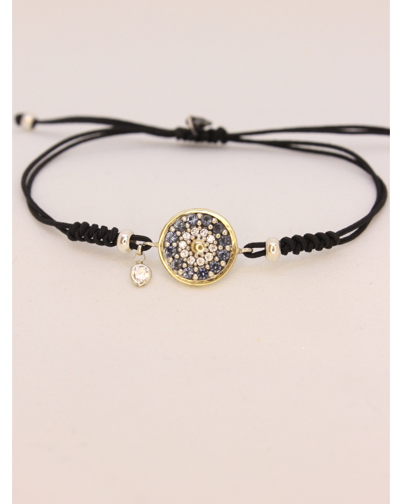 Pulsera de plata de ley con oro, espinelas blancas y azules.
Ajustable a todas las medidas mediante cierre en forma de nudo cor