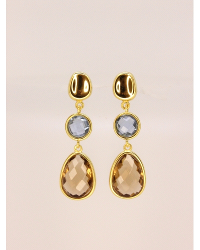 Pendientes de plata de primera ley (925) con baño de oro amarillo y circonitas en color azul y marrón.

Cierre de presión.

