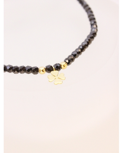 Pulsera de oro amarillo de primera ley (750) trébol&nbsp;con espinela negra. ( medida extensible: de 15 a 23 cm)