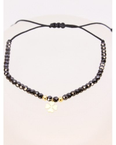 Pulsera de oro amarillo de primera ley (750) trébol&nbsp;con espinela negra. ( medida extensible: de 15 a 23 cm)