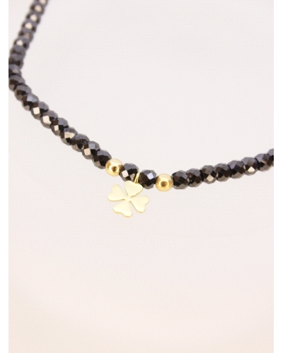 Pulsera de oro amarillo de primera ley (750) trébol&nbsp;con espinela negra. ( medida extensible: de 15 a 23 cm)