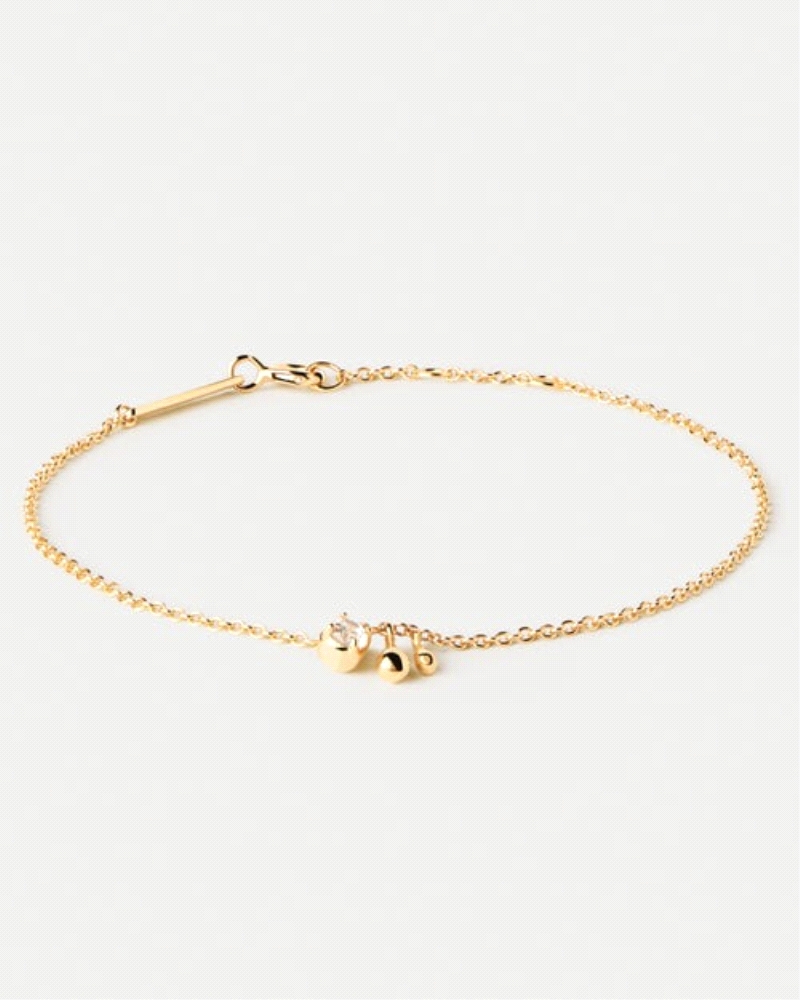 Pulsera de plata bañada en oro con circonita blanca y dos colgantes