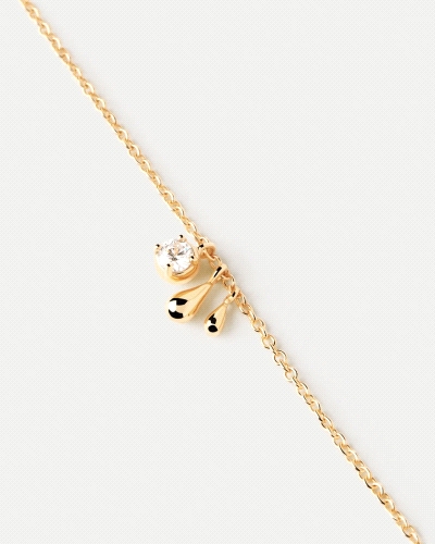 Pulsera de plata bañada en oro con circonita blanca y dos colgantes