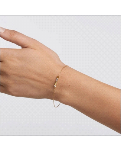 Pulsera de plata bañada en oro con un set ondulado de circonitas multicolores