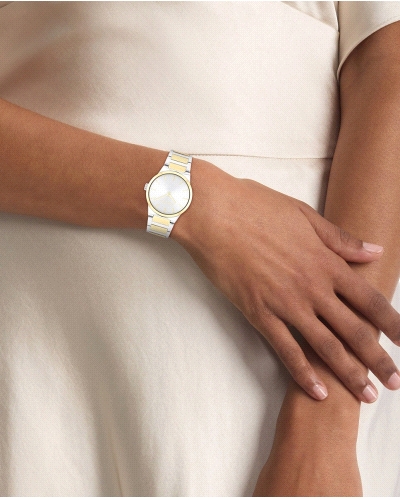 El Calvin Klein CK 25100113 Linear Elegance es un reloj de cuarzo bicolor para mujer, en acero inoxidable plateado y dorado, co