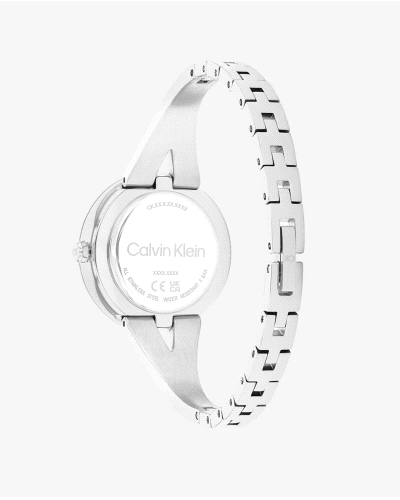 El Calvin Klein CK 25100026 Joyful es un reloj de cuarzo para mujer en acero inoxidable plateado, con caja redonda de 30 mm, esf