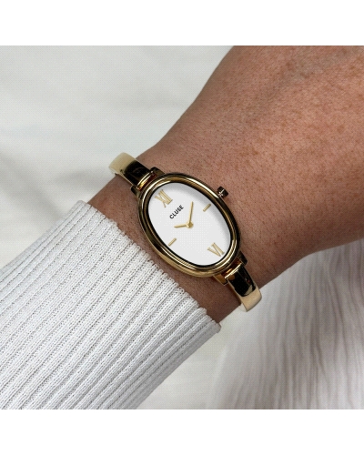 El reloj ovalado L'Ovale para mujer cuenta con una caja dorada de 22 mm, una esfera blanca y una correa de acero inoxidable dora