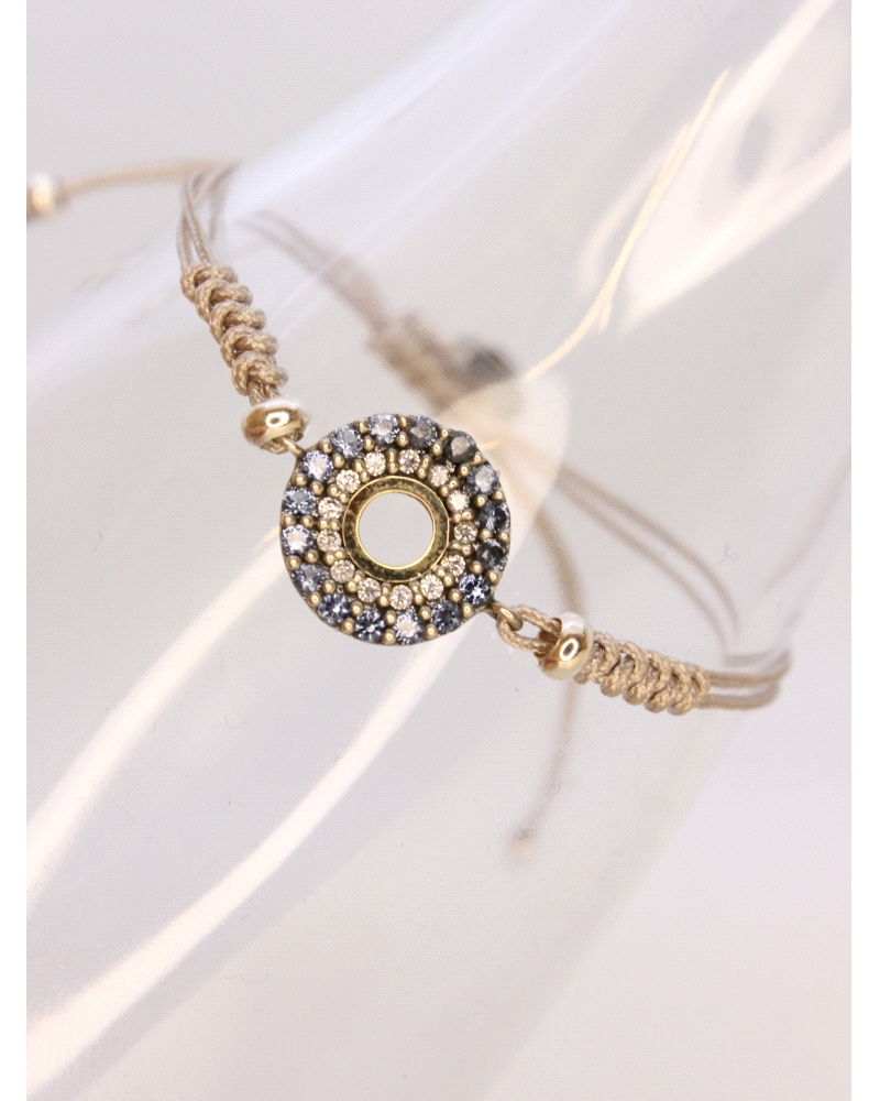 Pulsera de plata de ley con oro, espinelas blancas y azules.
Ajustable a todas las medidas mediante cierre en forma de nudo cor