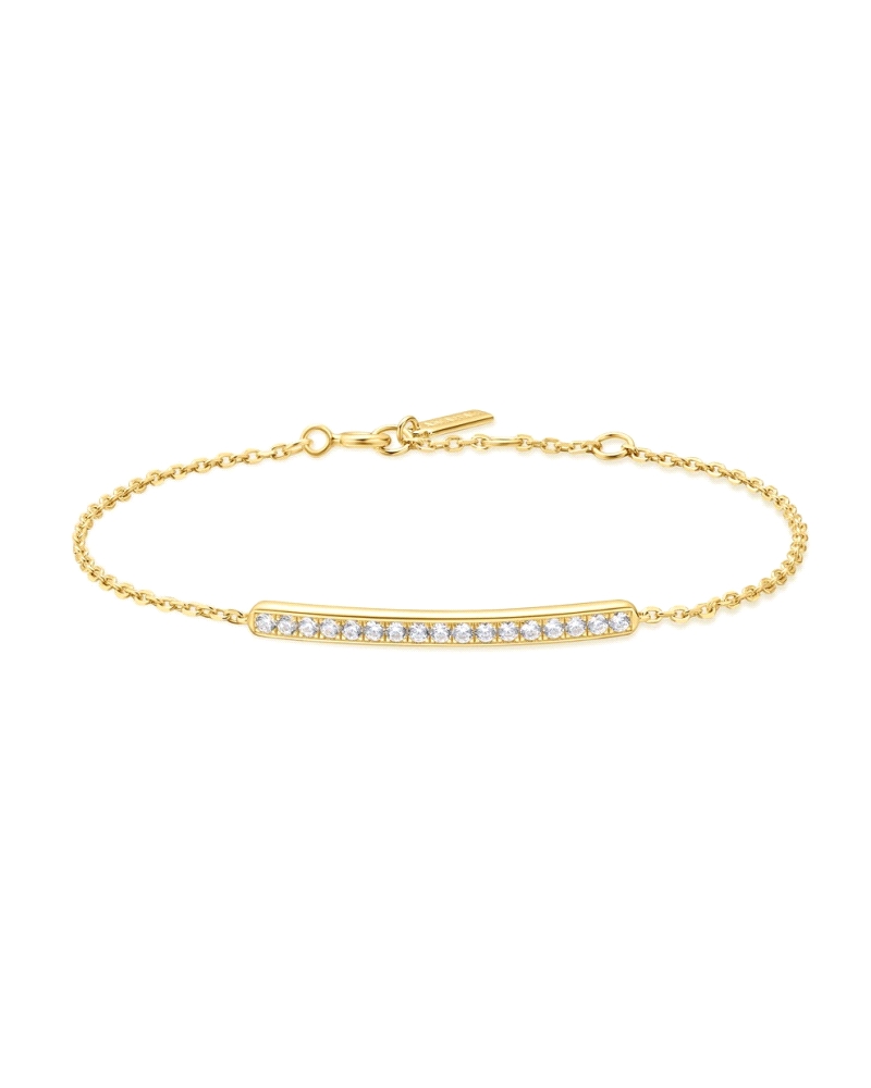 Pulsera dorada con barra empedrada de circonitas.