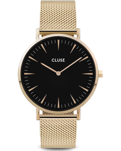 Reloj analógico con movimiento de cuarzo. Caja de acero inoxidable con acabado dorado, esfera negra protegida por cristal minera